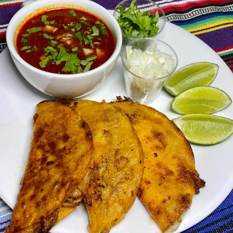 Delicious Quesabirria Tacos Await
